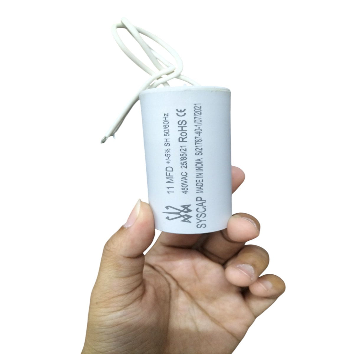 11MFD 450 VAC Running Capacitor by Syscap held in hand for electrical circuit applications