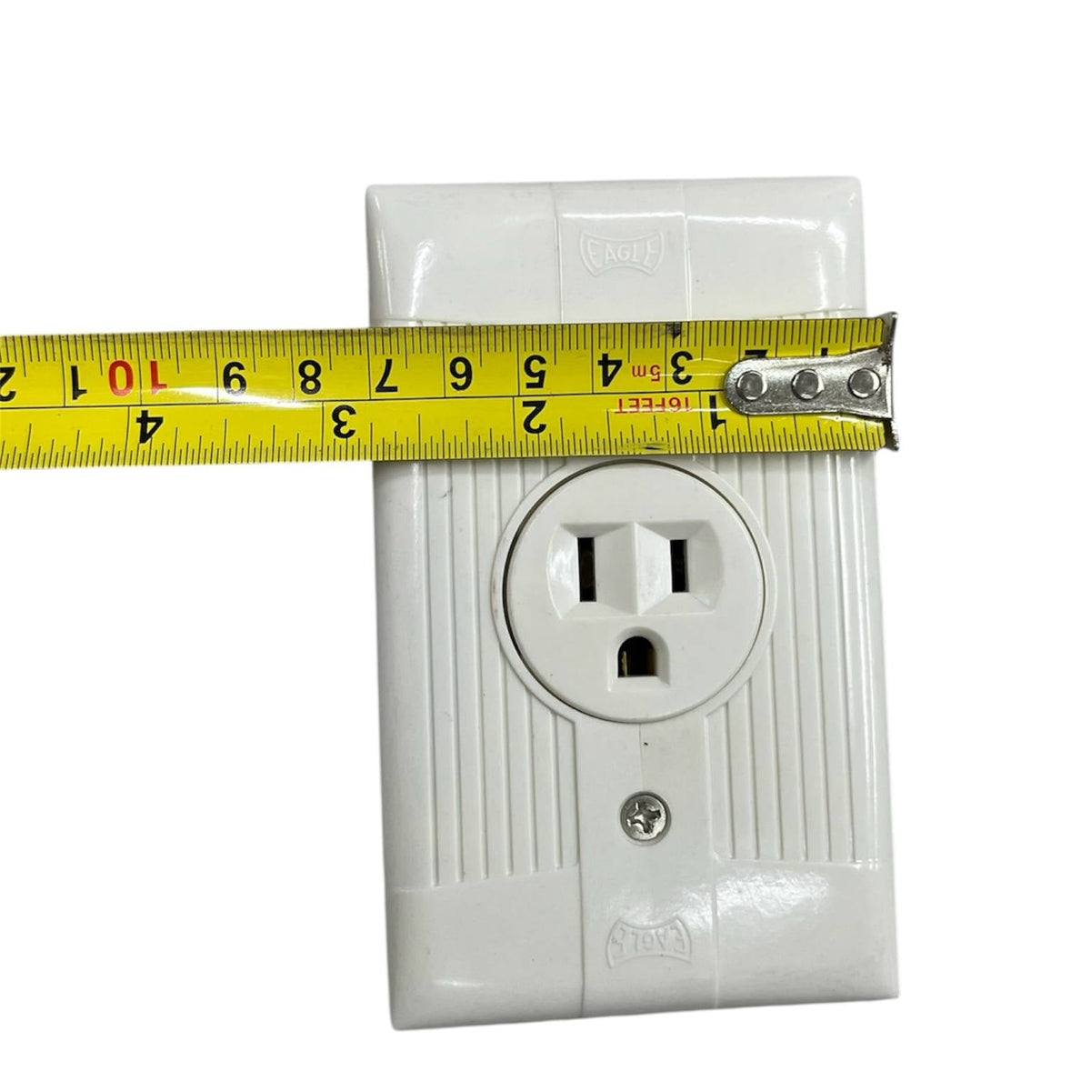 Eagle 15a 250v electrical outlet white with measurement tape for reference
