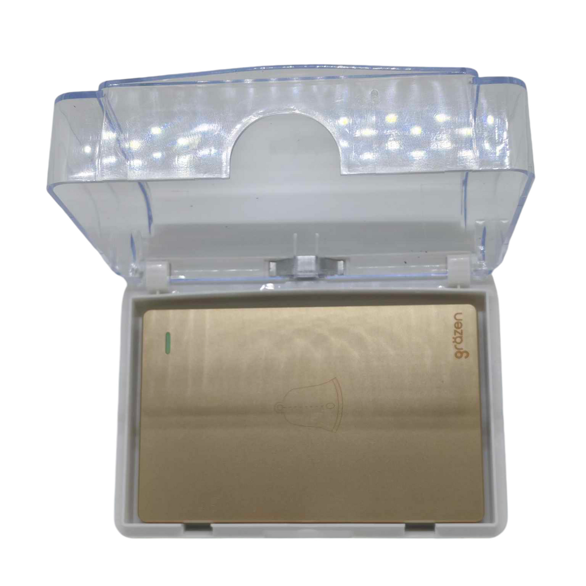 A compact UV lamp device with a clear plastic lid and a metallic gold interior panel, shown open on a plain white background.