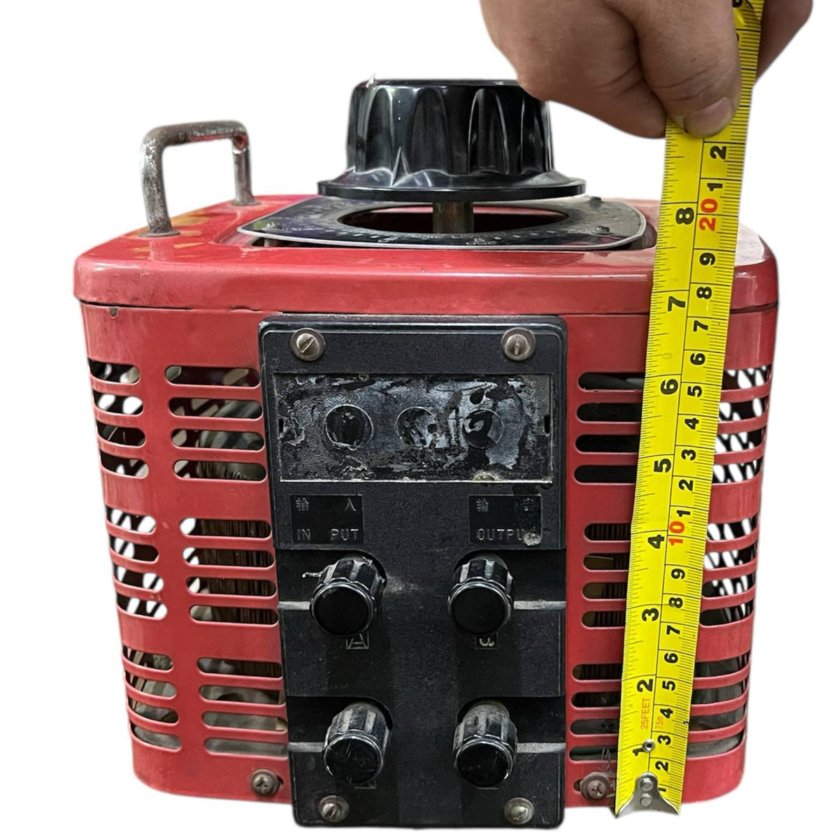 Stavol 5000W variac transformer in red with black control knobs being measured with yellow tape
