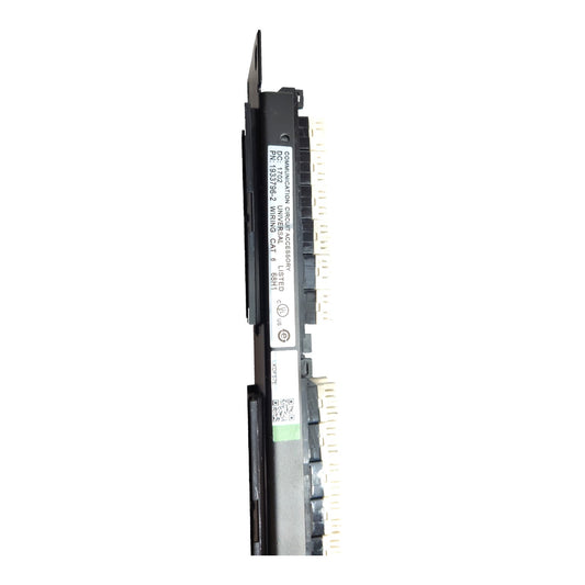 A long, narrow black electronic component or module with printed labels and gold-toned connector pins along one side, shown vertically on a plain white background.