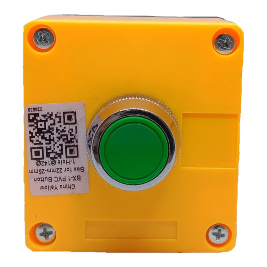 A square yellow industrial push button box with a central green button and silver metal bezel, shown against a plain white background.