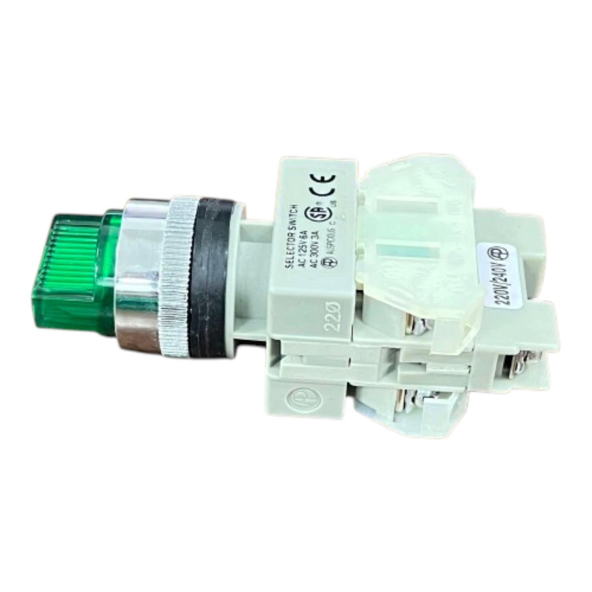 A small industrial electrical relay or selector switch component with a translucent green light module, a silver metal ring, and a light gray plastic housing, shown on a plain white background.