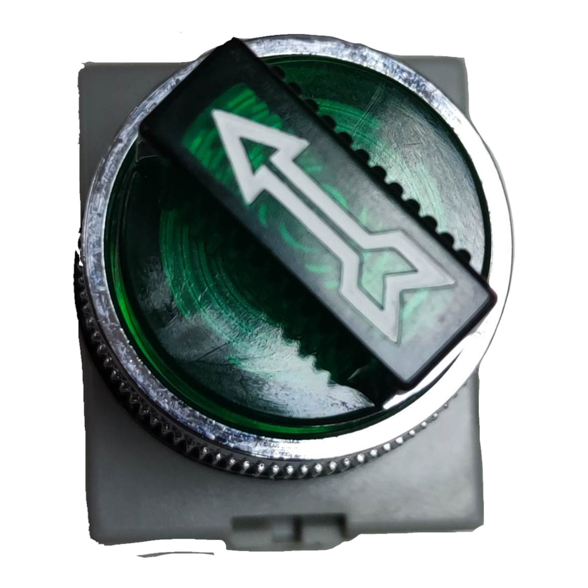 A circular green button with a silver metal rim and a black rectangular cover featuring a white arrow pointing diagonally upward, set against a plain white background.