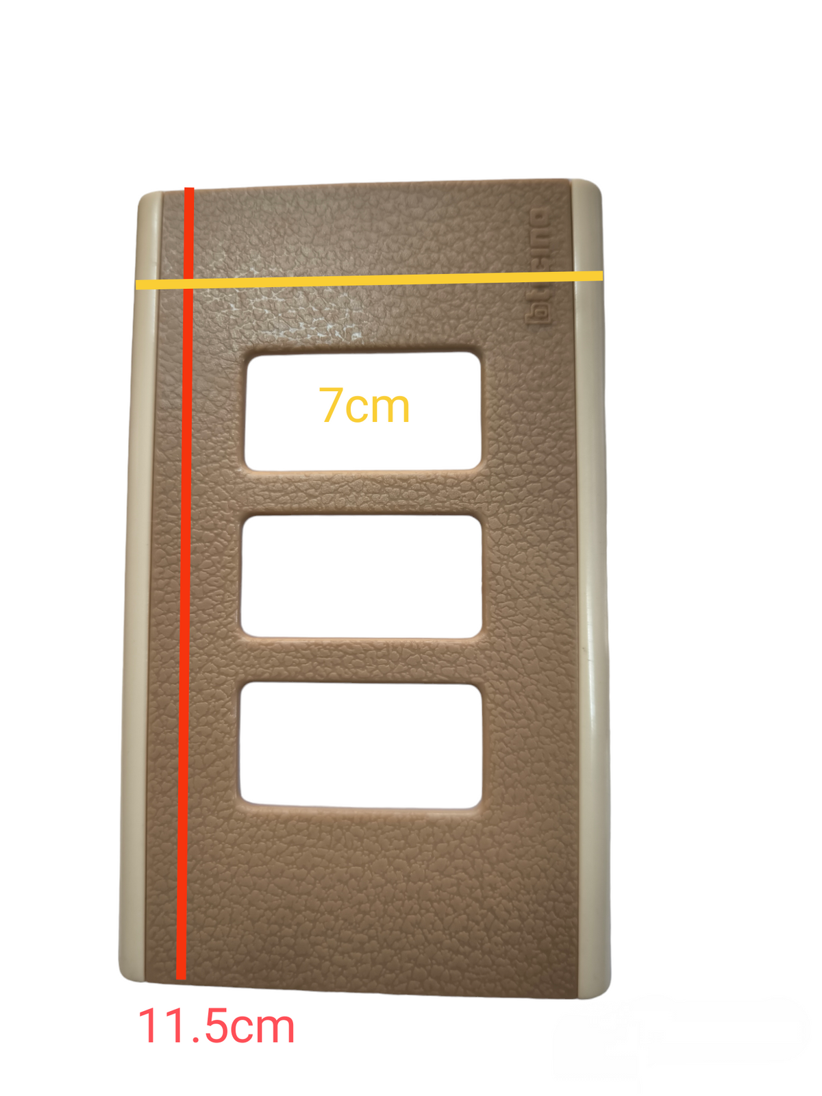 Bticino switch plate cover in brown textured finish with three rectangular openings and beige edges