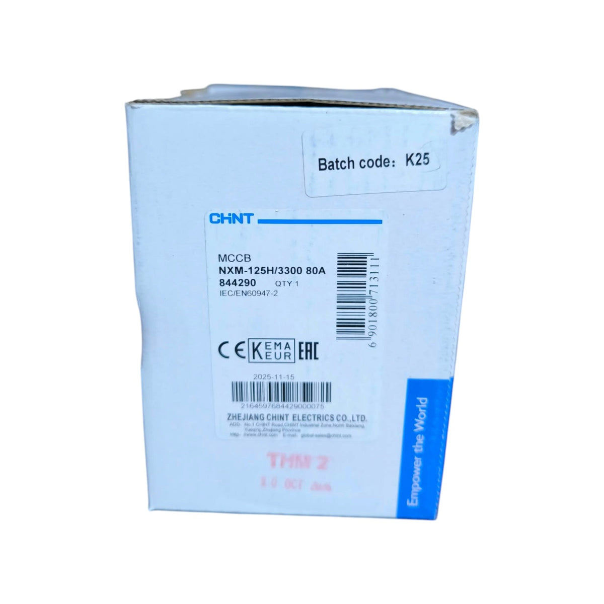 A light blue cardboard box for a CHINT MCCB electrical component, showing printed specifications, barcodes, and a blue vertical brand strip on the right side.