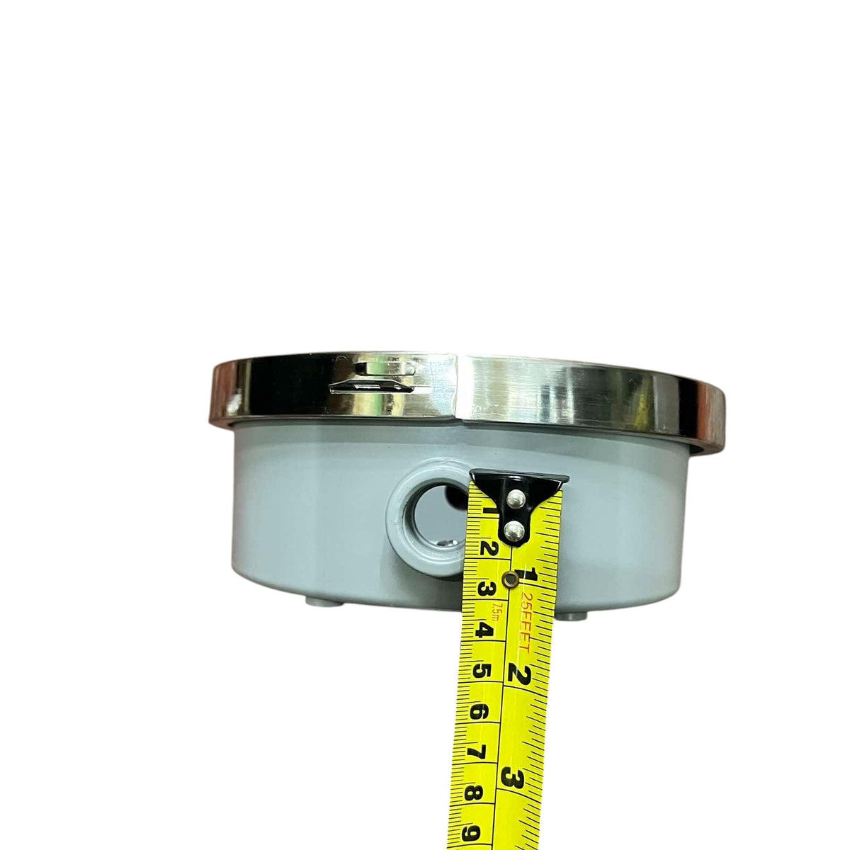 Metallic component with a tape measure for scale on a white Cirtech Round Meter Base 1/2 inch Hub Electrical Meter Base KWH Meter Base 4 Jaws Electx Electrical Supplybackground