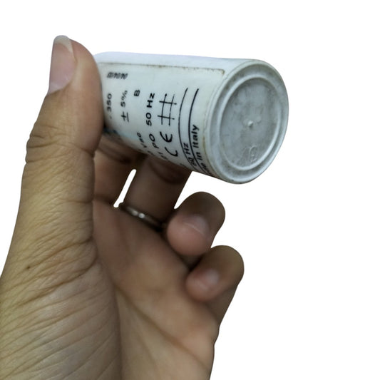 Comar Motor Running Capacitor 350V AC held in hand, ideal for improving motor performance