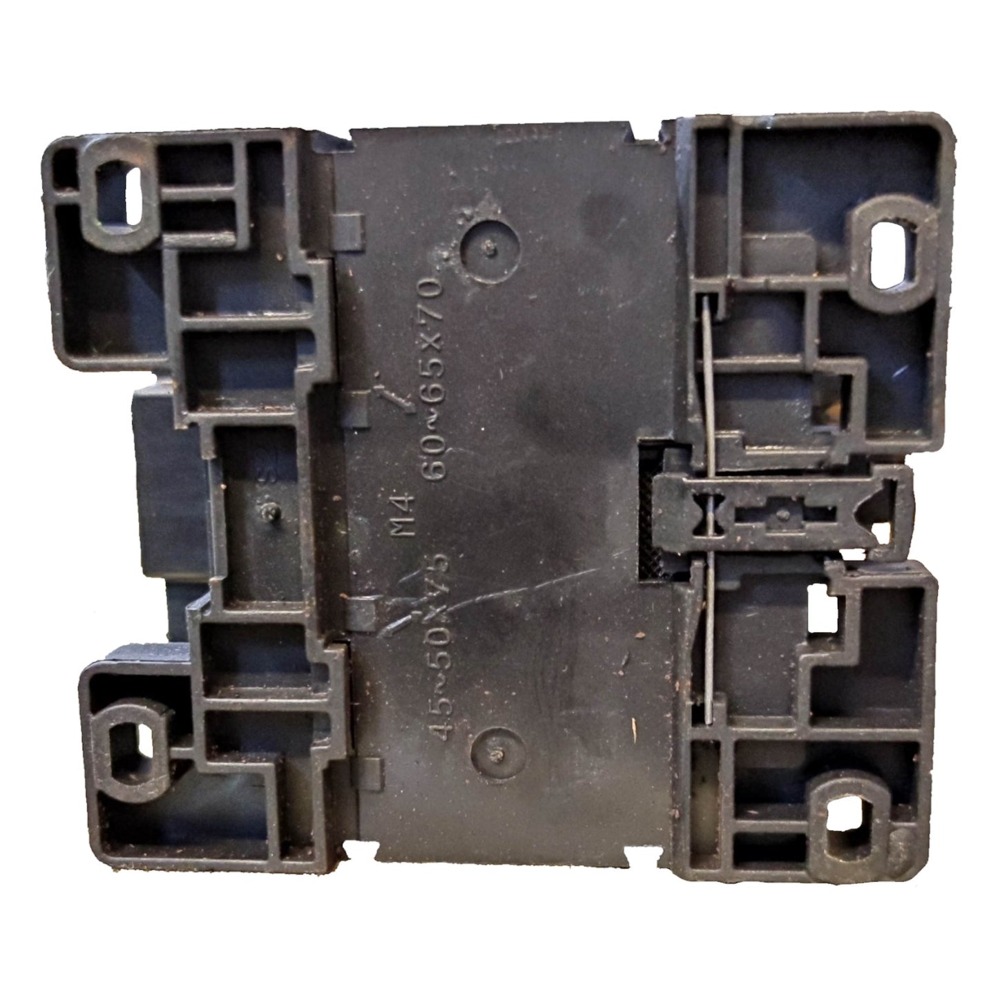 Black plastic component with text and markings on a white background