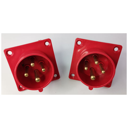 Two red electrical connectors on a white background