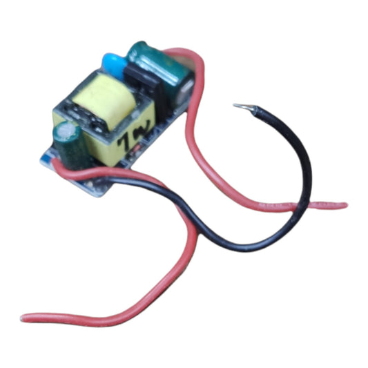 A small electronic transformer module with a yellow core, blue and green cylindrical components, and two wires, one red and one black, on a plain white background.