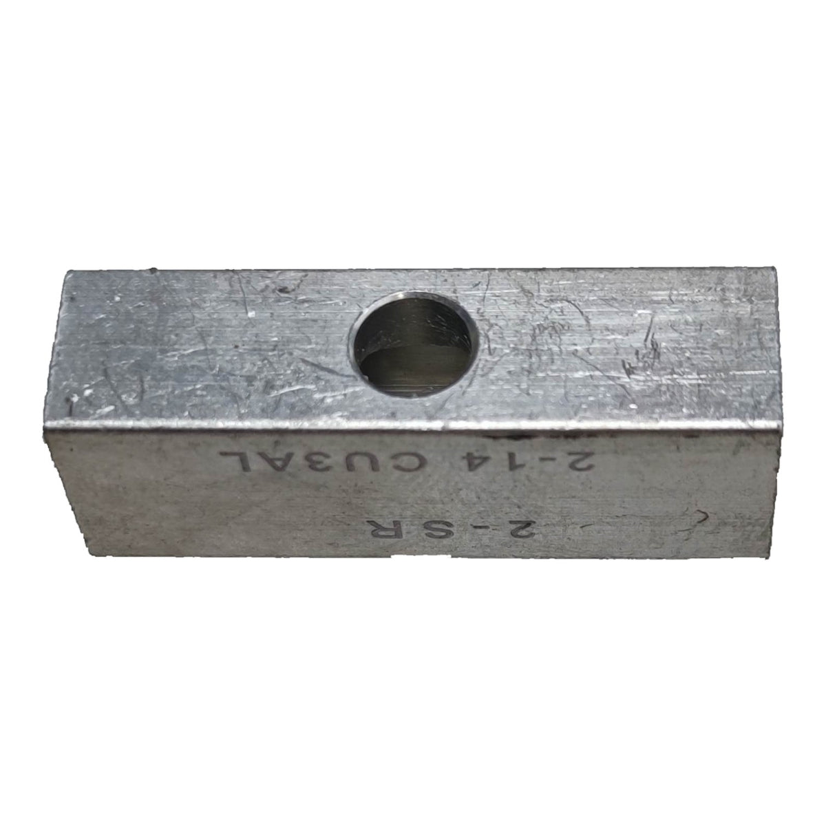 Metal block with a hole and engraved text on a white background