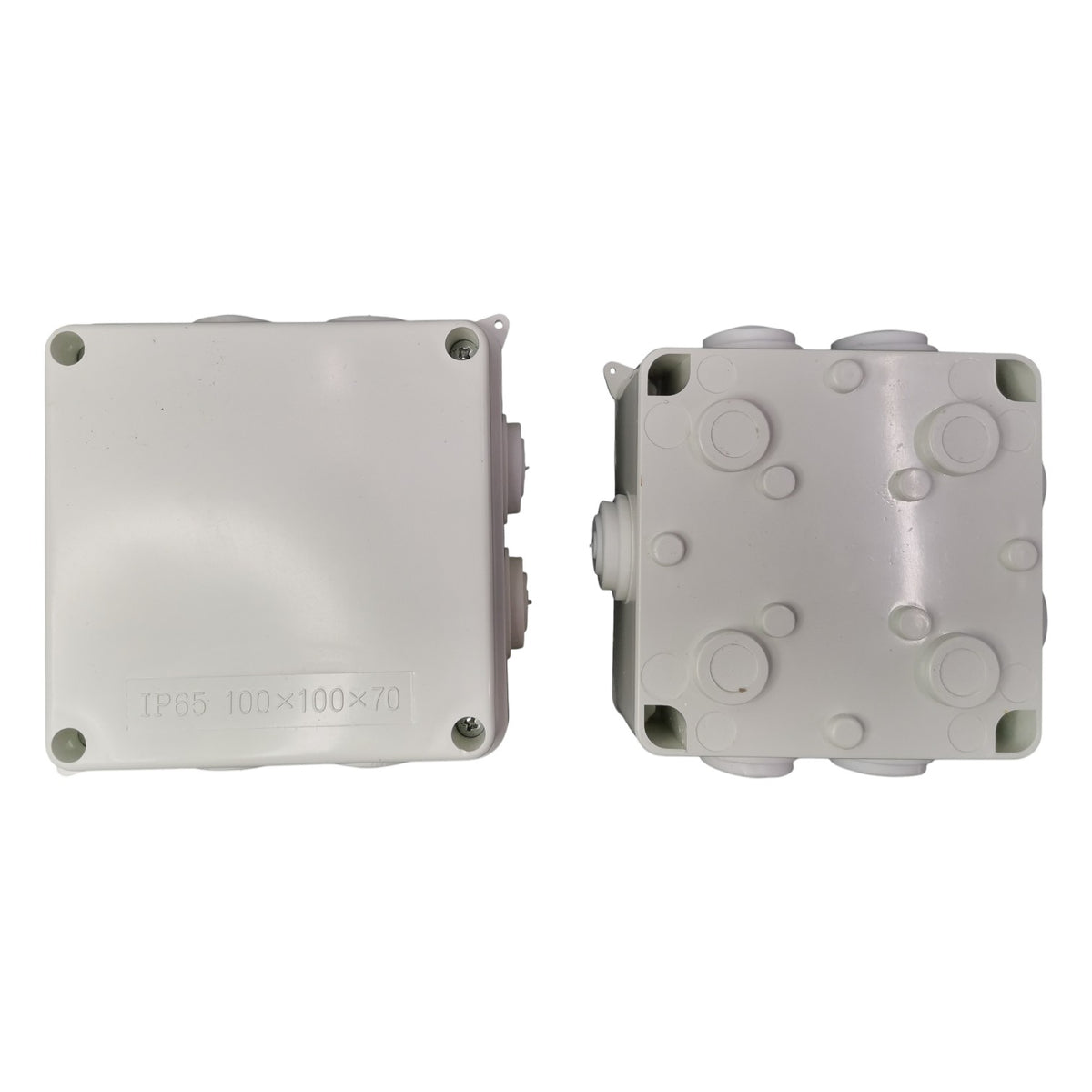 Two gray plastic junction boxes on a white background