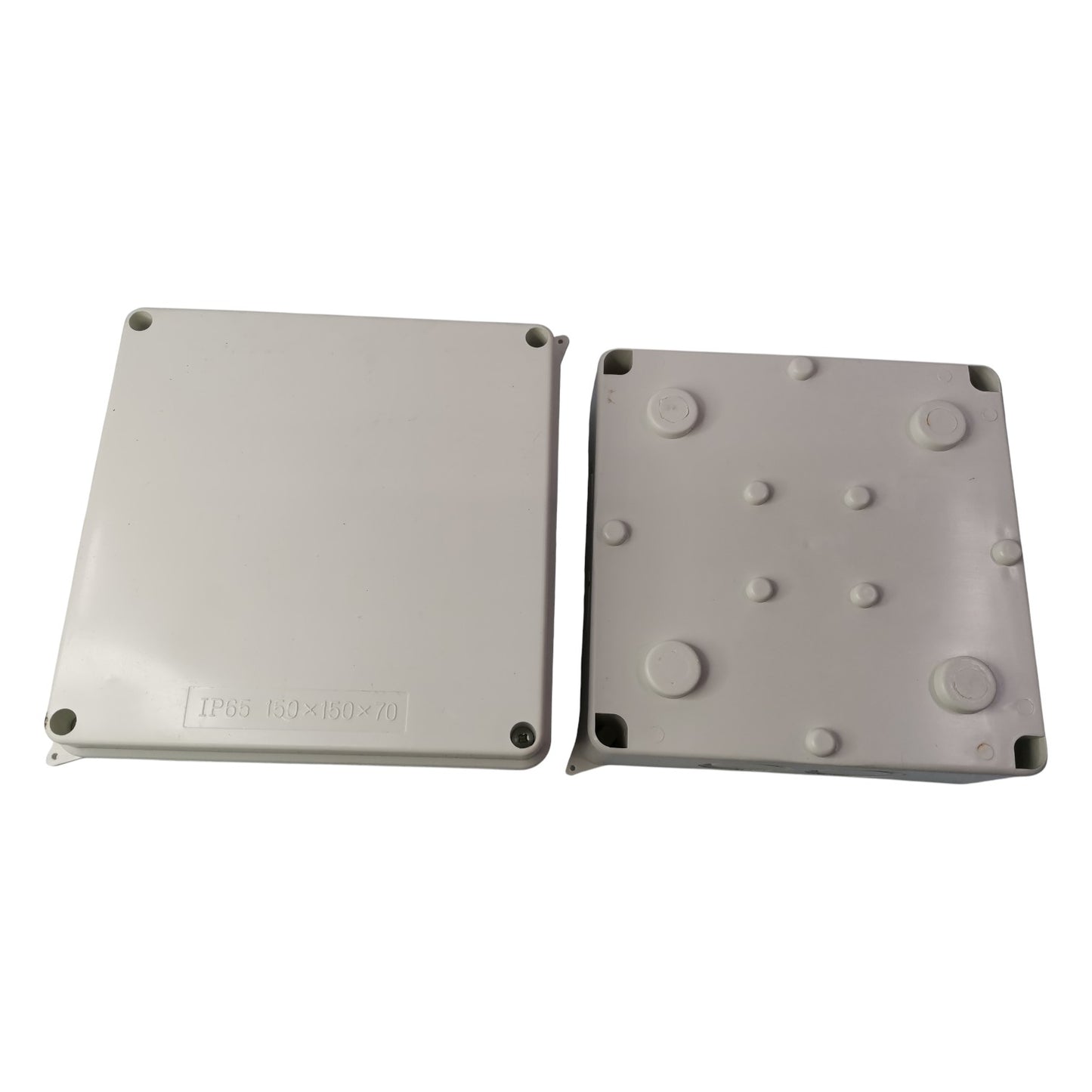 Two gray plastic enclosures with textured surface on a white background
