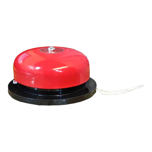 A red dome-shaped fire alarm bell with a black circular base and a thin wire extending from the right side, shown against a plain white background.