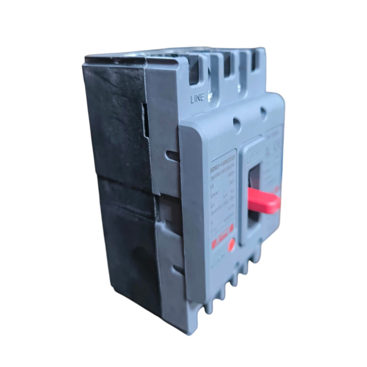 A gray plastic circuit breaker with a red handle and black internal components, shown on a plain white background.