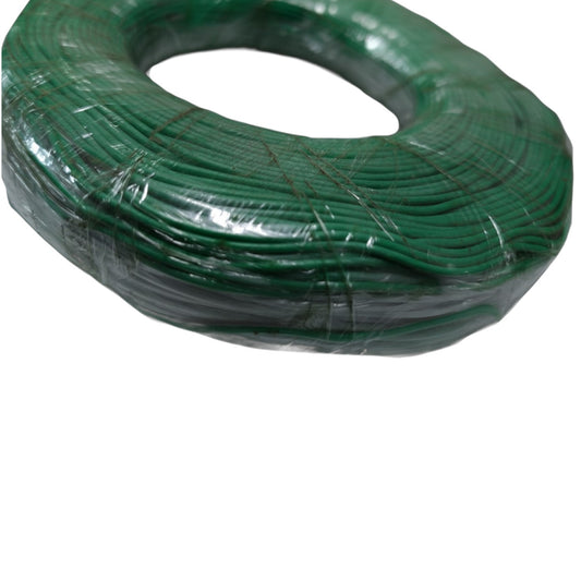 Coiled green wire on a white background