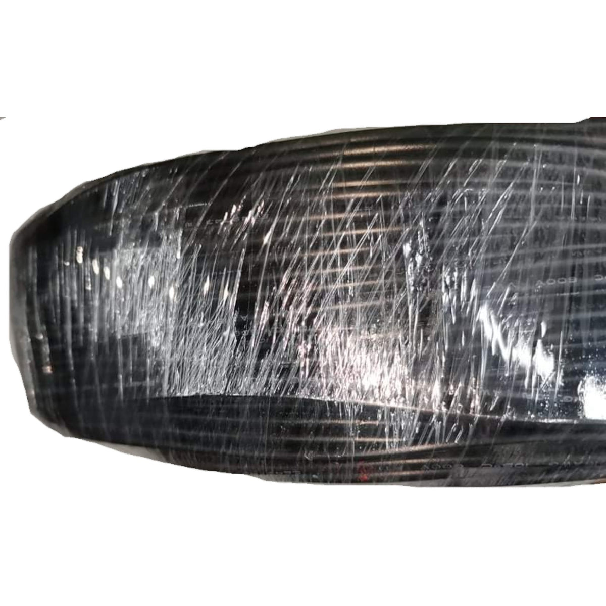 Car headlight with visible scratches on a white background