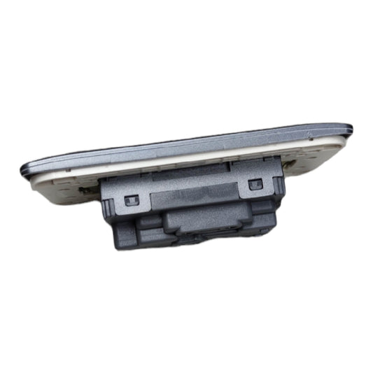 A replacement automotive light assembly, likely a rear license plate light or tail light component, featuring a gray plastic housing and a clear outer lens, shown against a plain white background.
