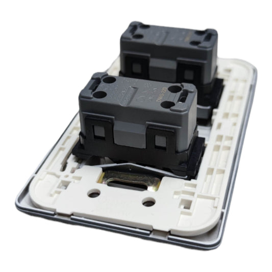 A two-gang double switch socket plate with black plastic rocker covers and a white backplate, shown on a clean white background.