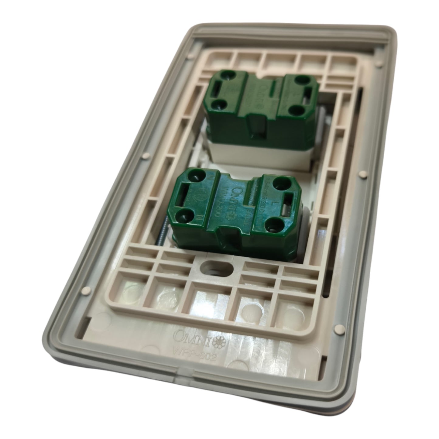 A replacement electrical switch plate cover with two green terminal blocks, shown on a clean white background.