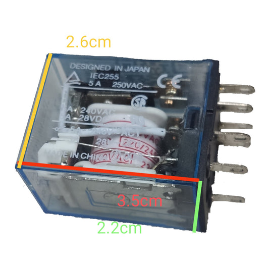 A transparent plastic electrical relay component with visible internal components and metal pins, shown on a white background with colored dimension lines and labels reading 2.6cm, 3.