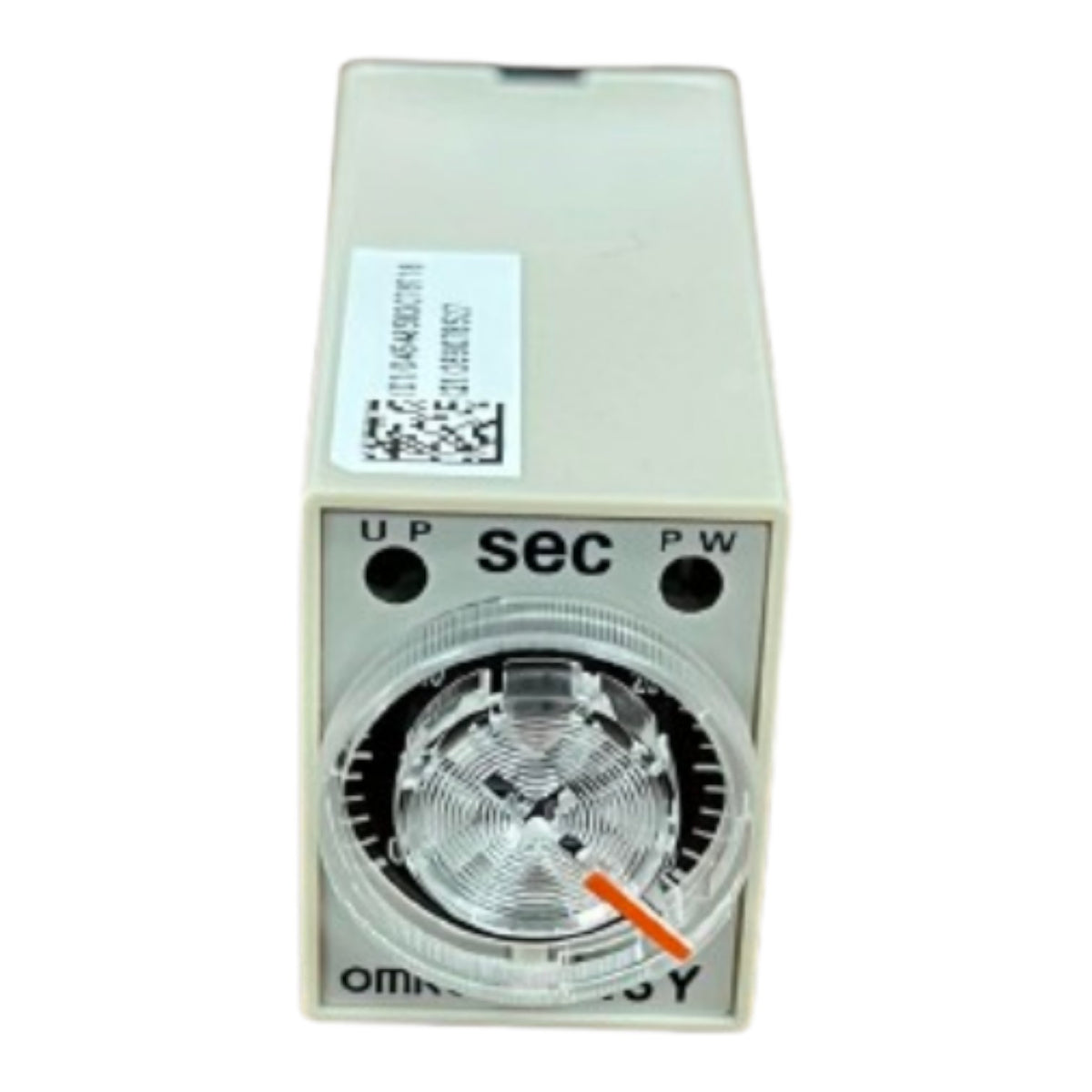 A small industrial timer relay or switch module with a beige plastic housing, a front dial window, and printed labels including 'UP', 'sec', 'PW', and 'OMM'. A white barcode sticker is visible on the top surface.