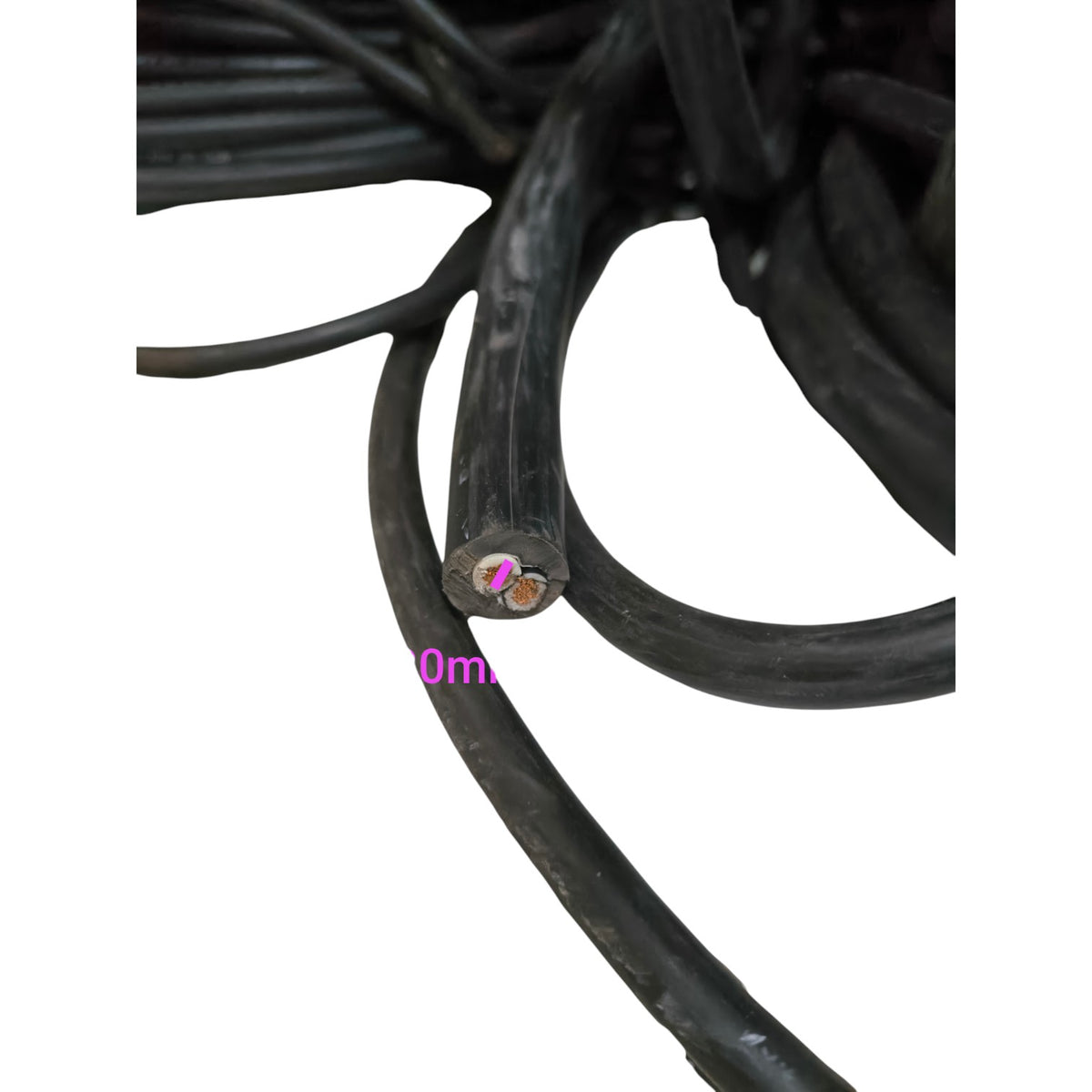 Close-up of black cable with measurement scale on a white background