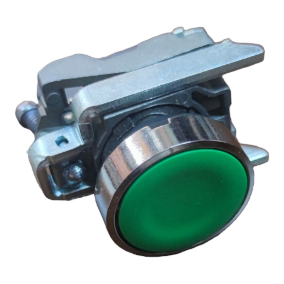 A heavy-duty industrial toggle switch with a metallic silver body and a prominent green circular button face, isolated on a white background.