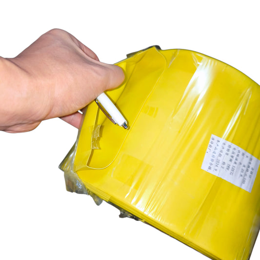 Hand opening a yellow package with a white background