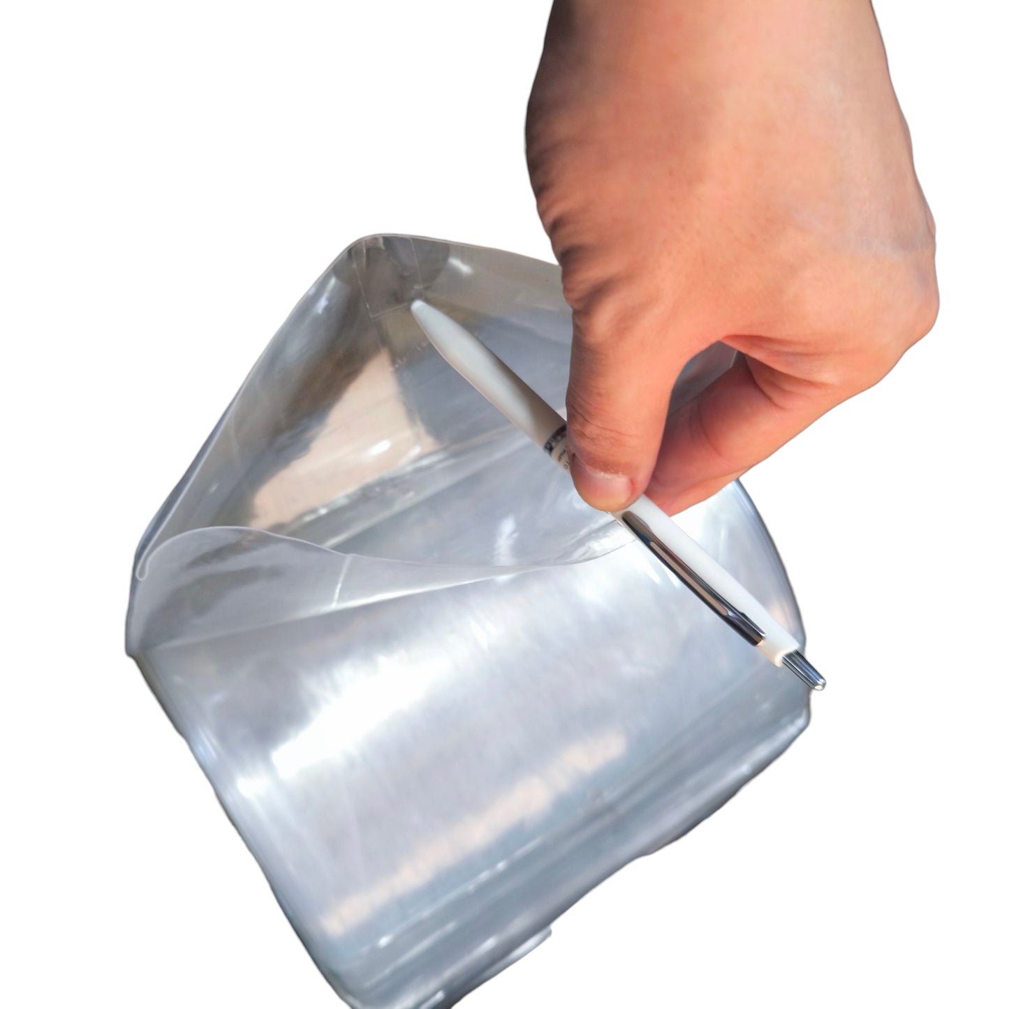 Hand holding a clear plastic bag over a square container on a white background