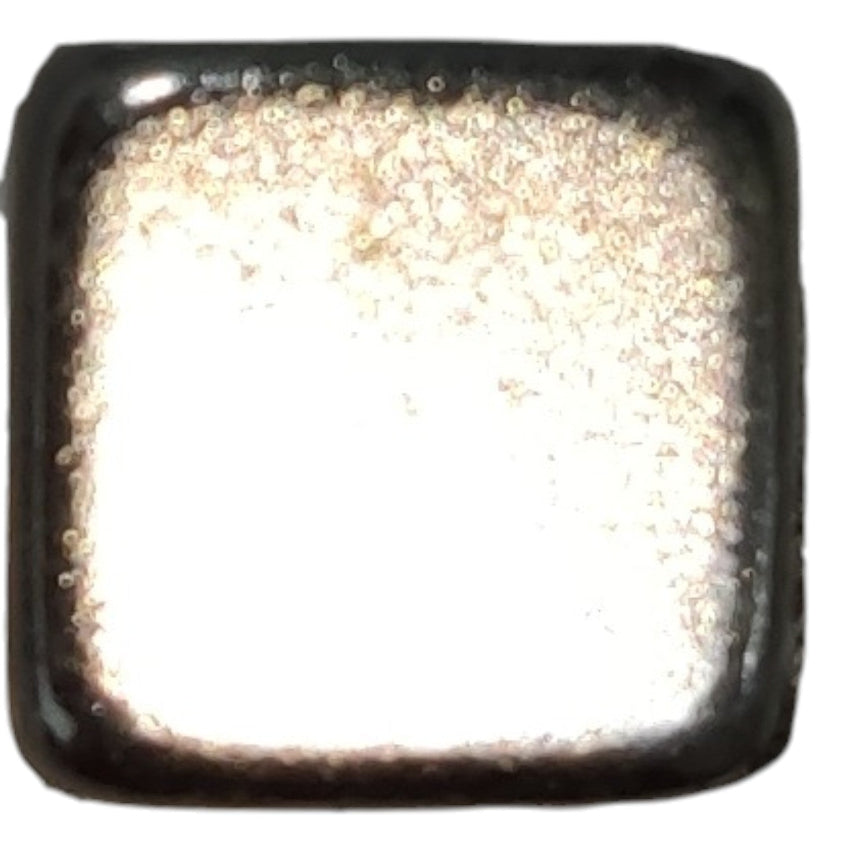 Square metallic object with reflective surface