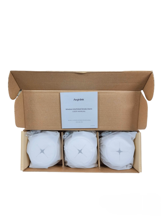 Aegislink wireless interlinked smoke alarm set with three alarms in an open cardboard box