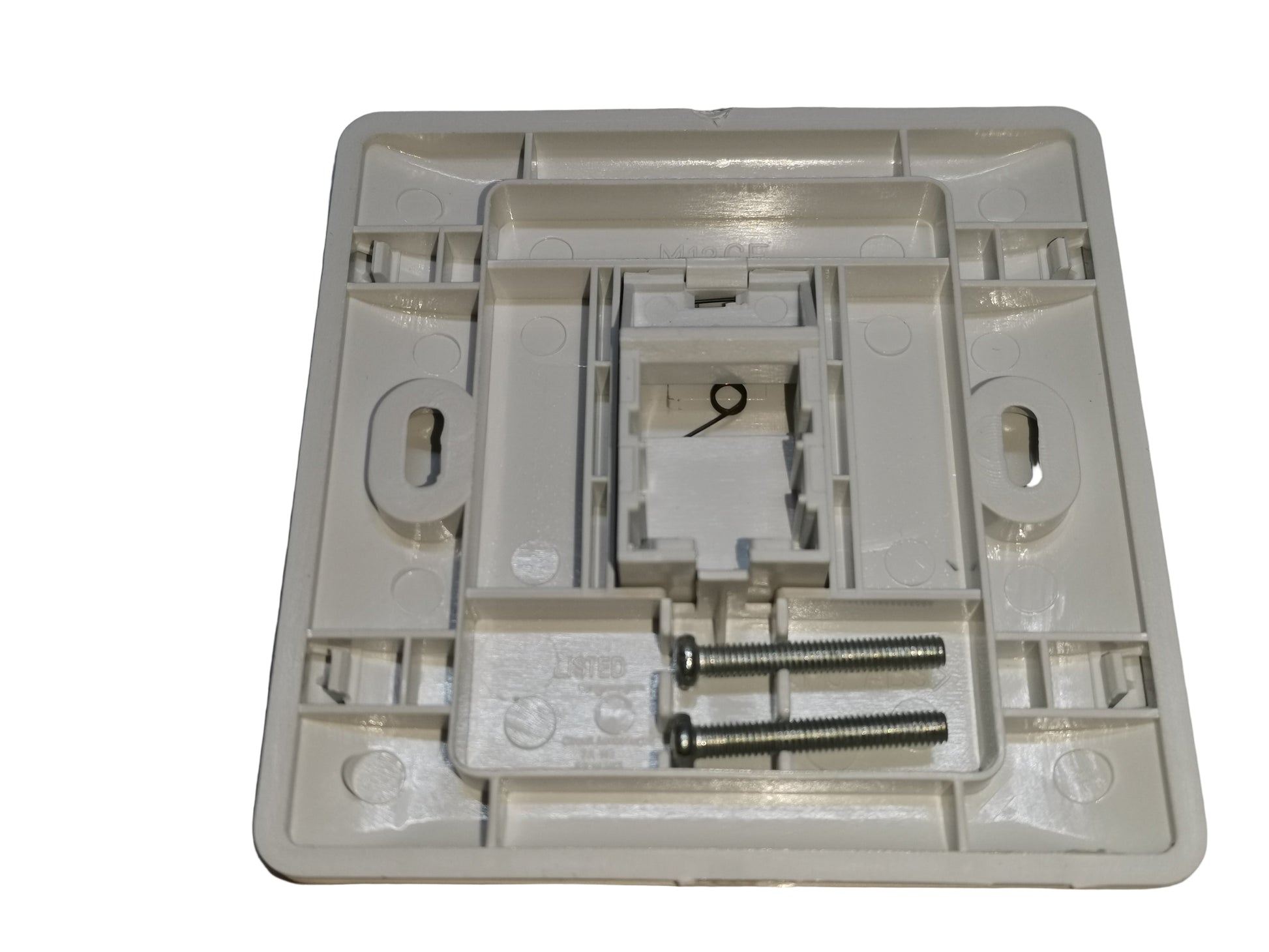 AMP 1 gang faceplate rear view showing mounting screws and inner structure for electrical switches