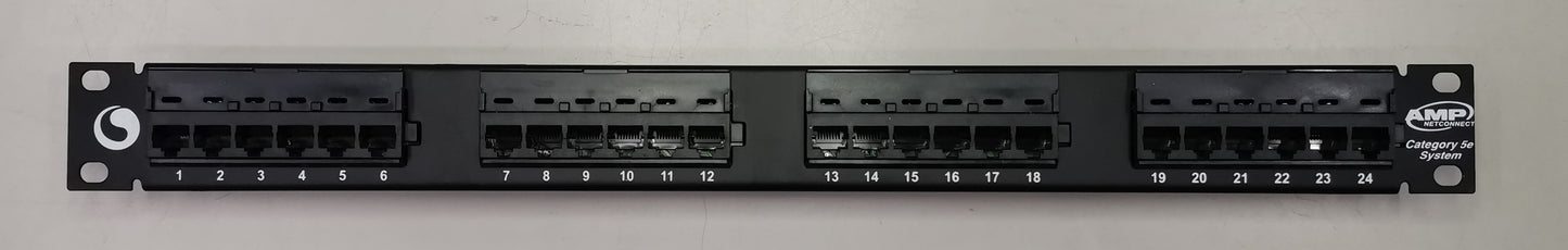 AMP CAT5E patch panel 24 port with black ports and labeled connection slots for network management
