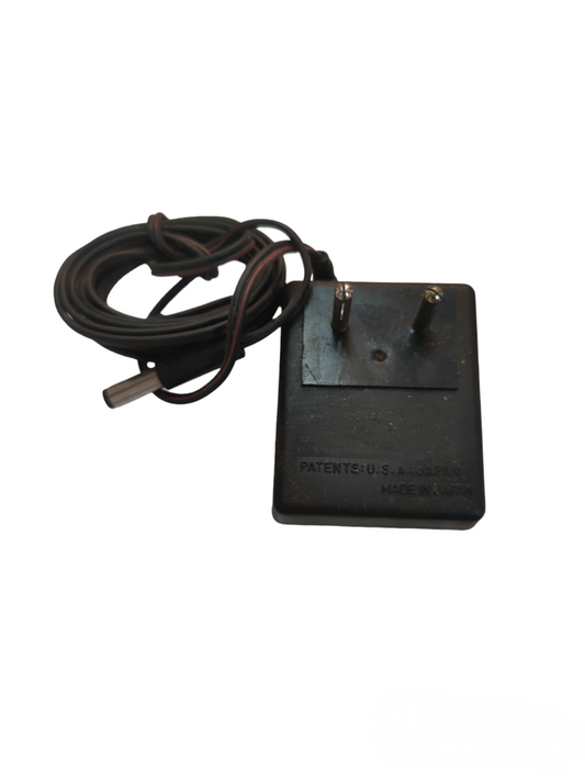 Local brand multi output AC adaptor with two-pin plug and attached black cable