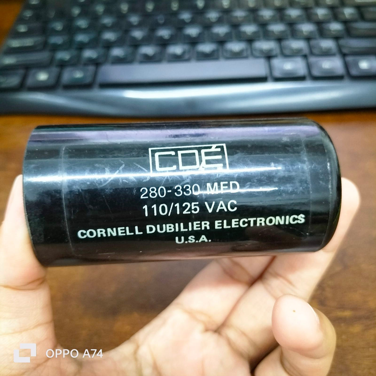 Brand CDE 280-330 MFD 110-125V black cylindrical electrical capacitor from Cornell Dubilier Electronics