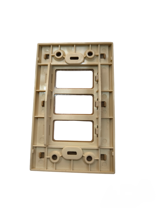 Beige Bticino switch plate cover with three rectangular openings for switches or outlets