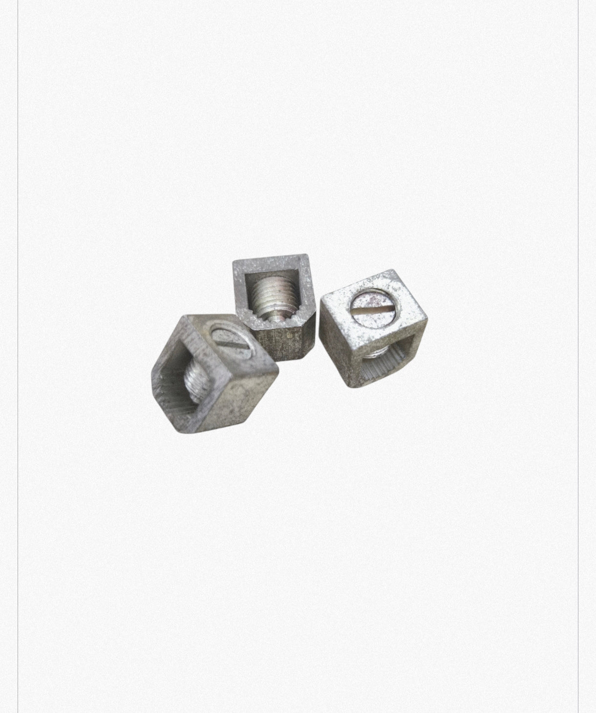 Three metal circuit breaker bolt on lugs used for electrical circuitry and parts by GE and Koten