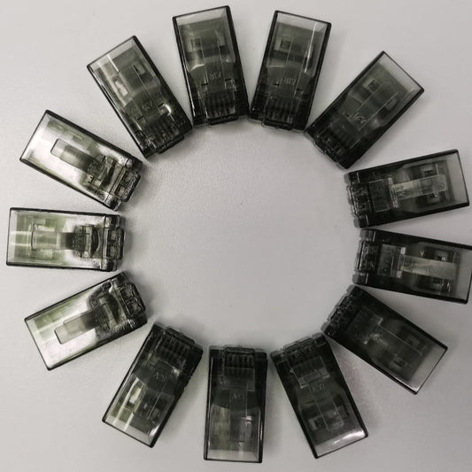 Circle of transparent black Denko RJ45 Connector colored adapters for powerline network connections