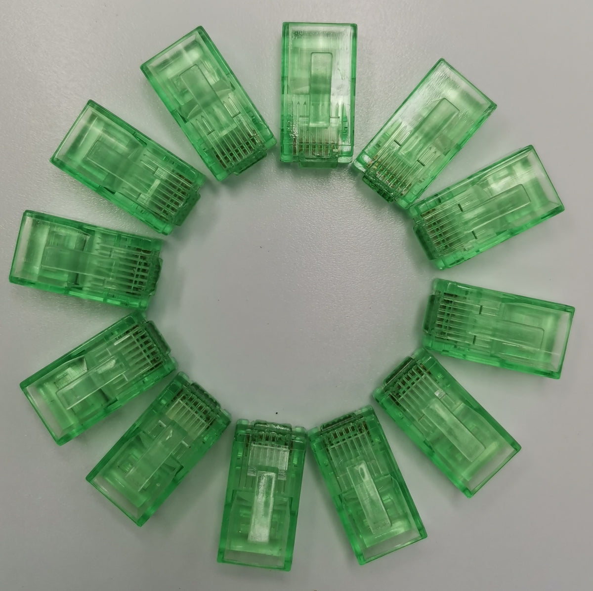 Grippes Denko RJ45 Connector colored powerline network adapter connectors arranged in a circular pattern