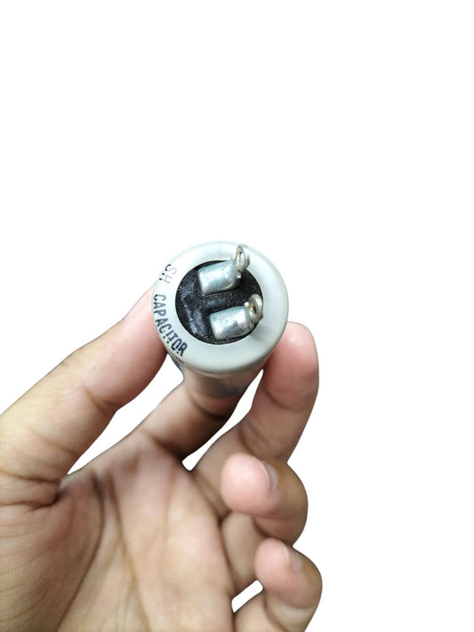 DRE 400V Motor Running Capacitor held in hand for electrical circuit applications