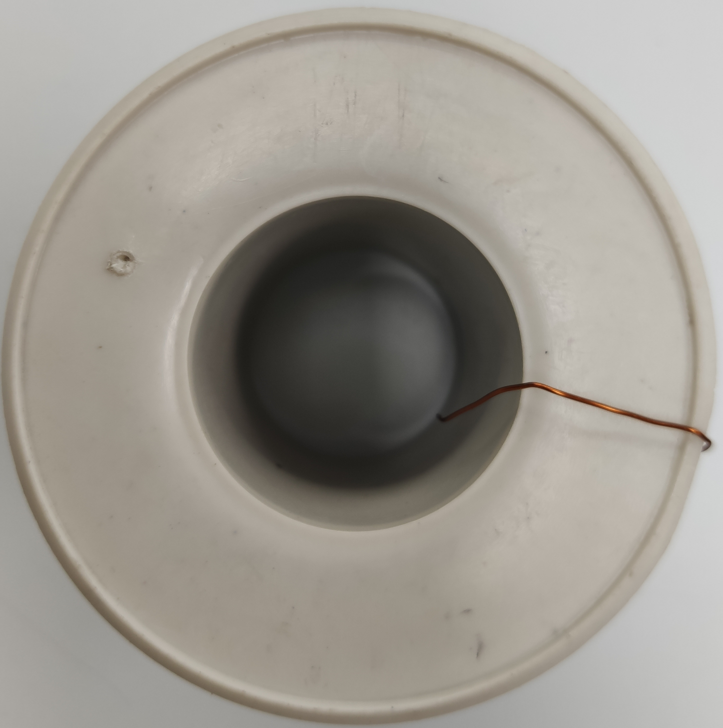 Philflex white plastic spool with copper magnet wire tail top view Magnet Wire AWG 43 - 200g
