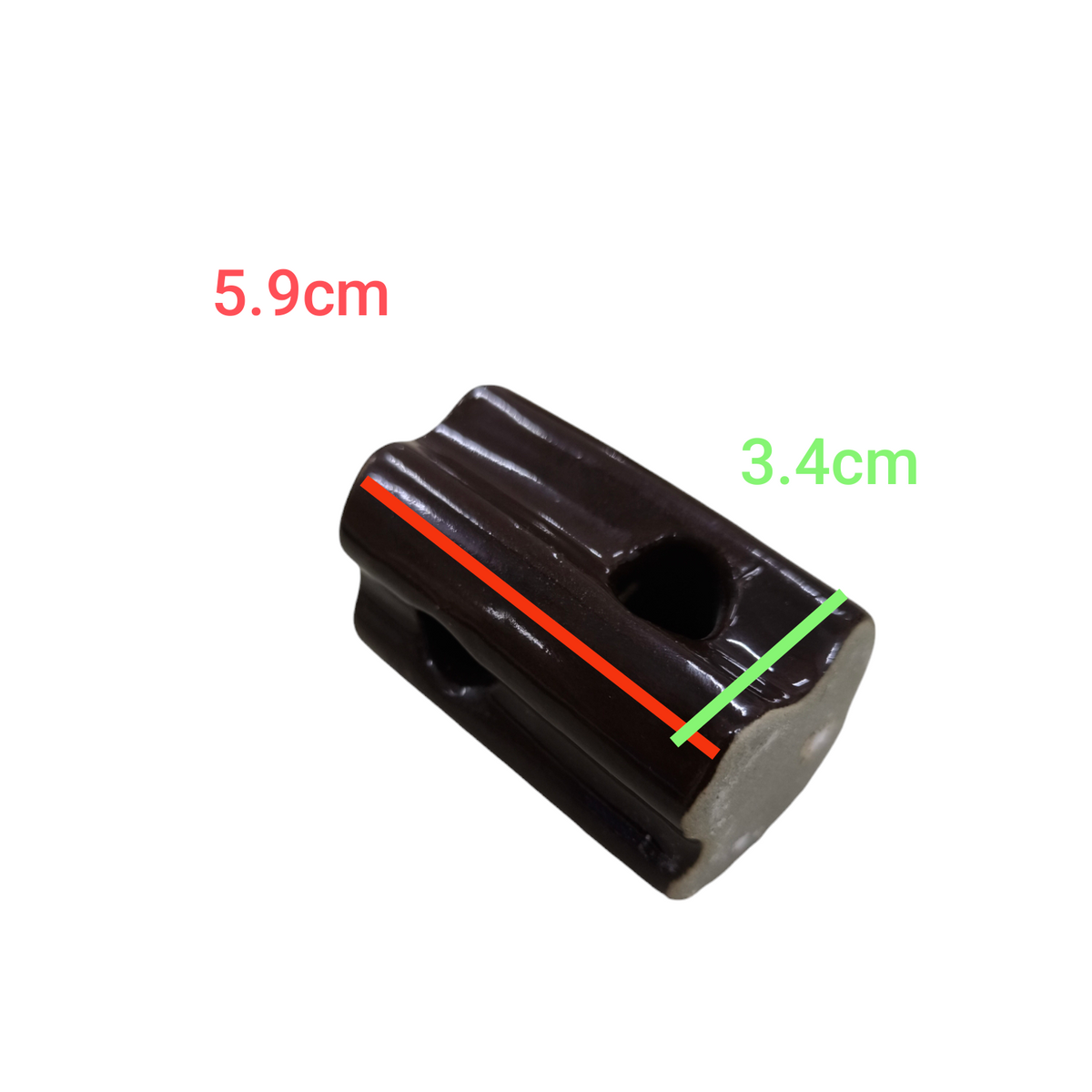 Local electrical ball insulator with 5.9 cm length and 3.4 cm width in dark ceramic material