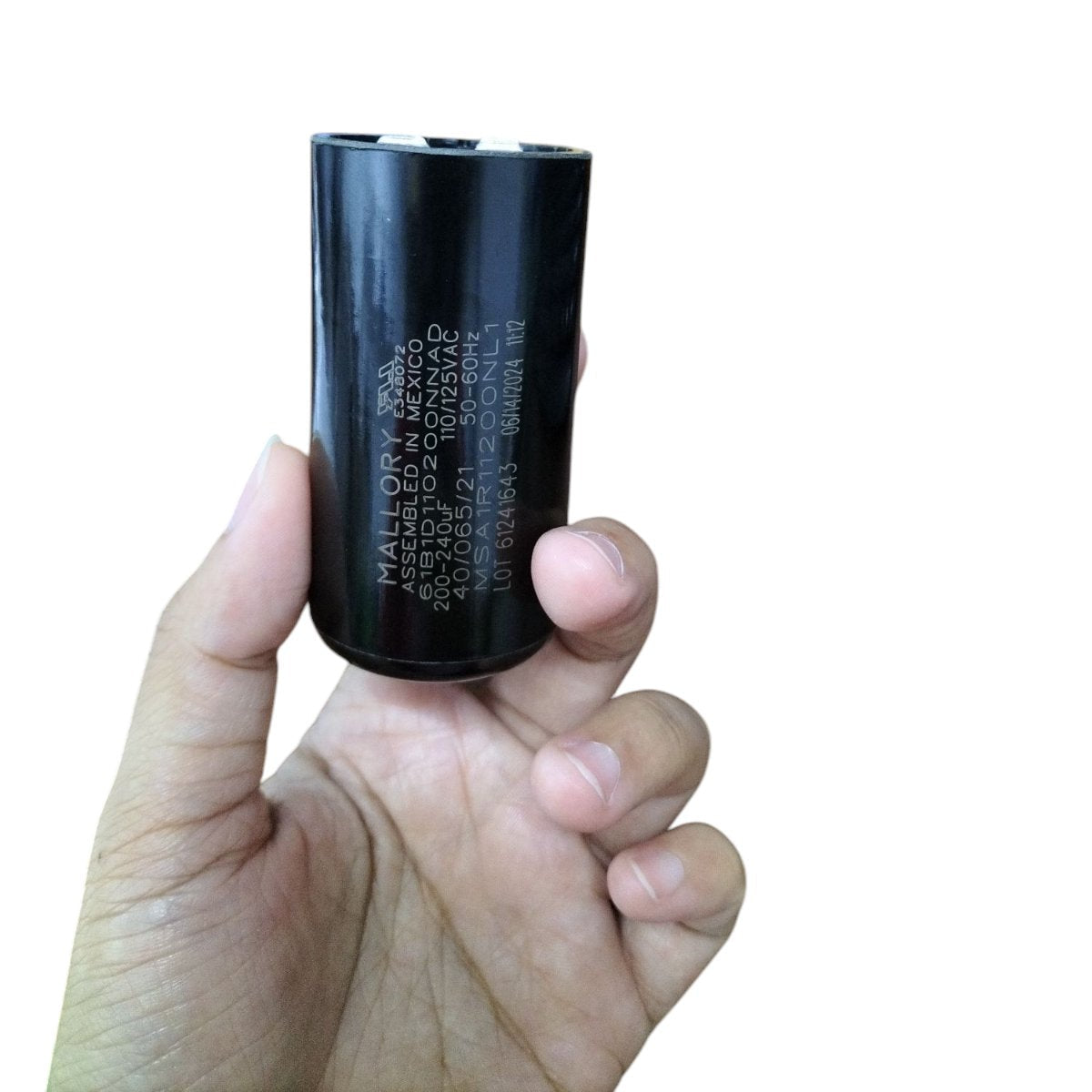 Mallory 200-240UF 110-125V AC start capacitor held in hand for easy reference