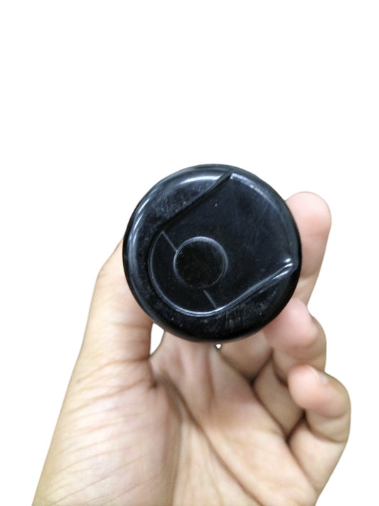 BMI Motor Starting Capacitor 38-46UF held in hand showcasing its compact design for electrical applications