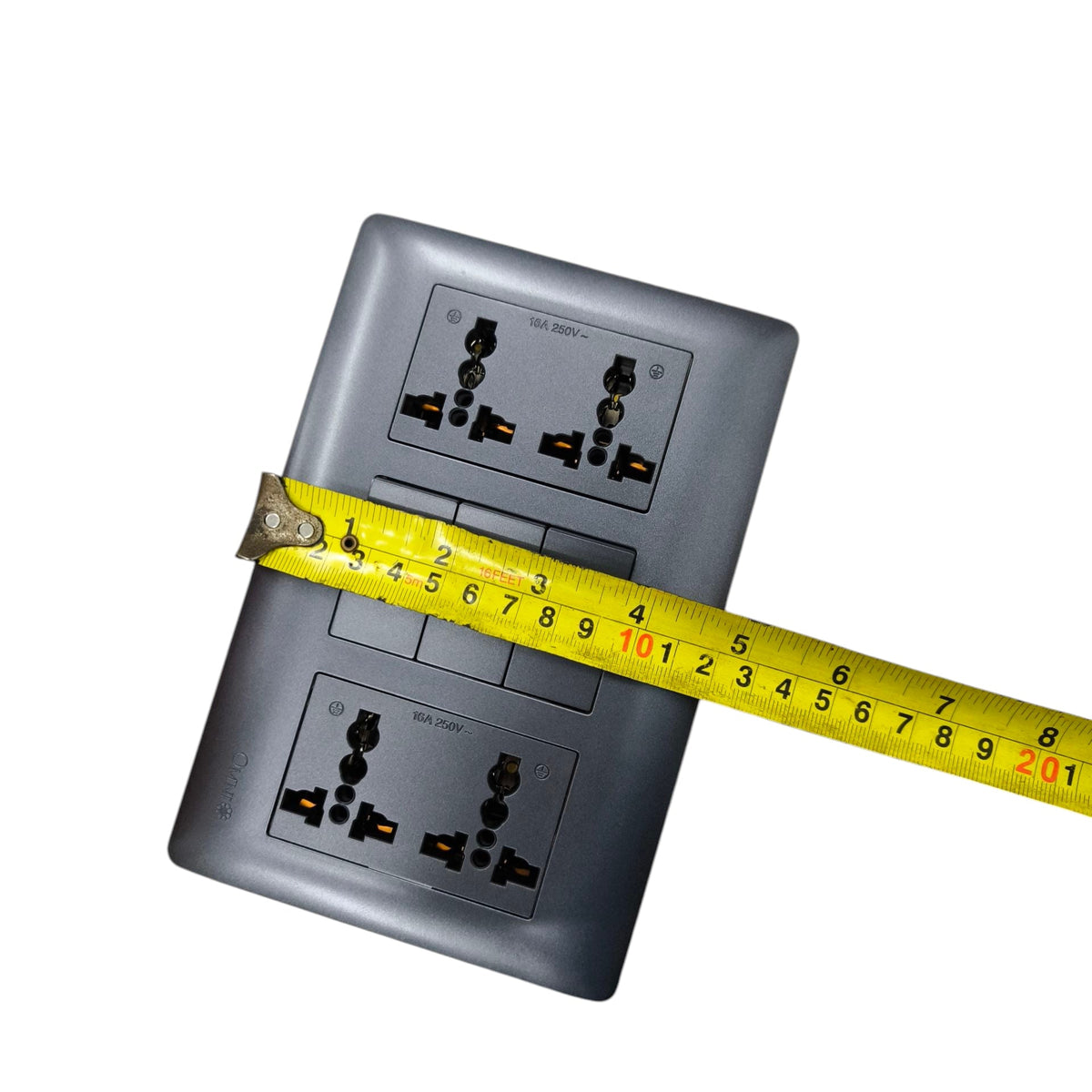 Omni 3 gang switch with 4 gang universal outlet shown with a measuring tape for size reference