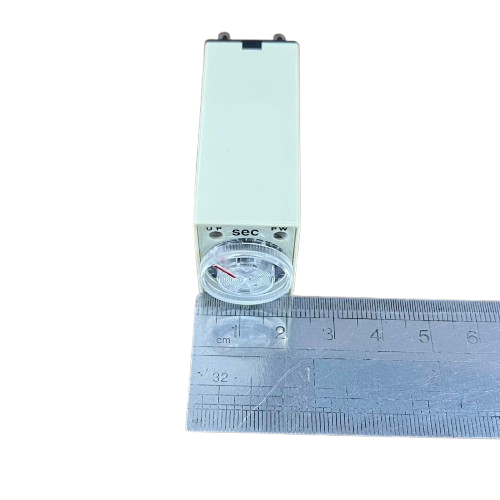 OMRON relay timer with front dial and clear knob on ruler showing size Timer Relay 10 seconds 8 pins 110V