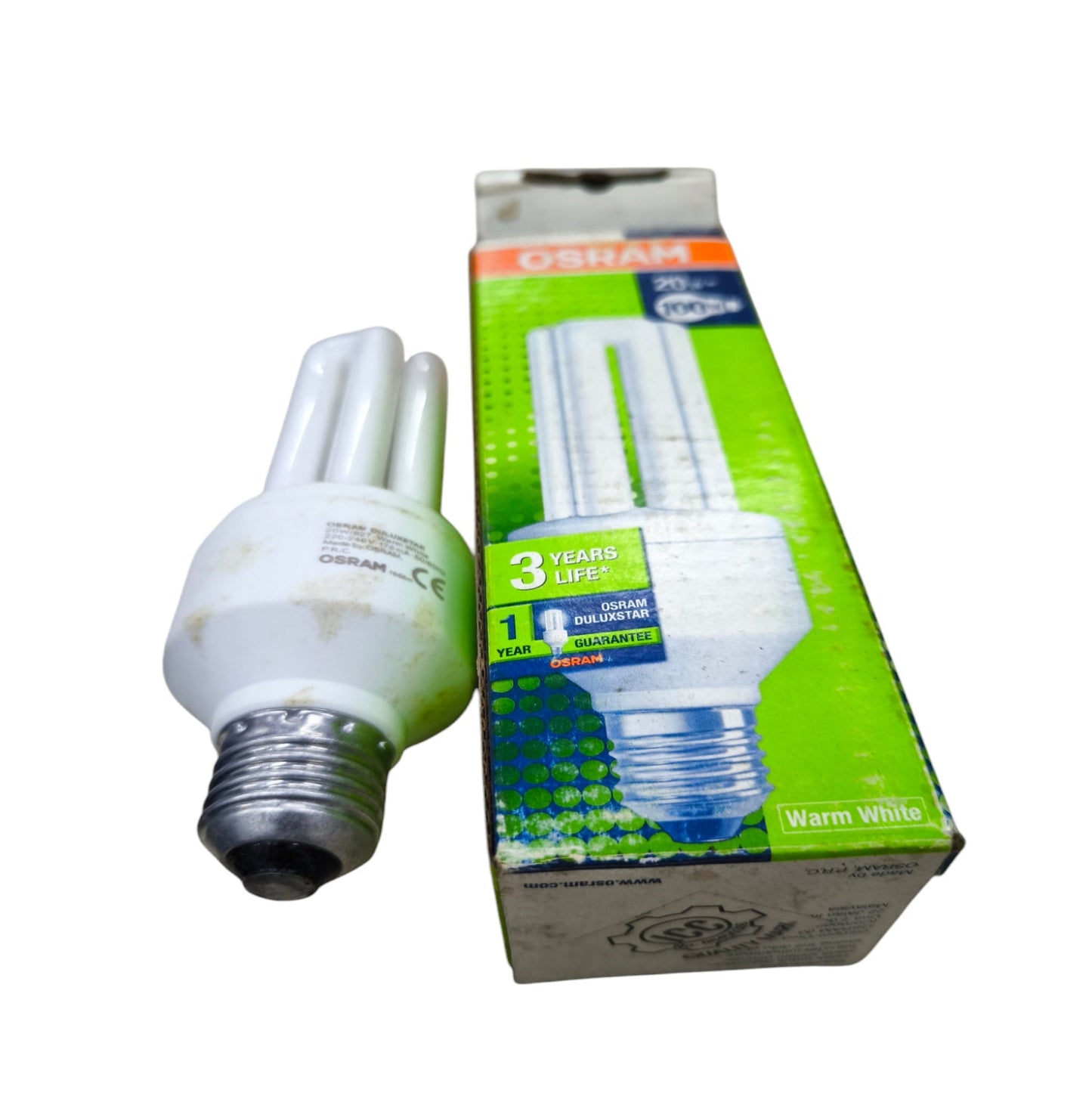 Osram Compact Fluorescent Lamp 20W E27 with warm white light and energy-saving design beside product box