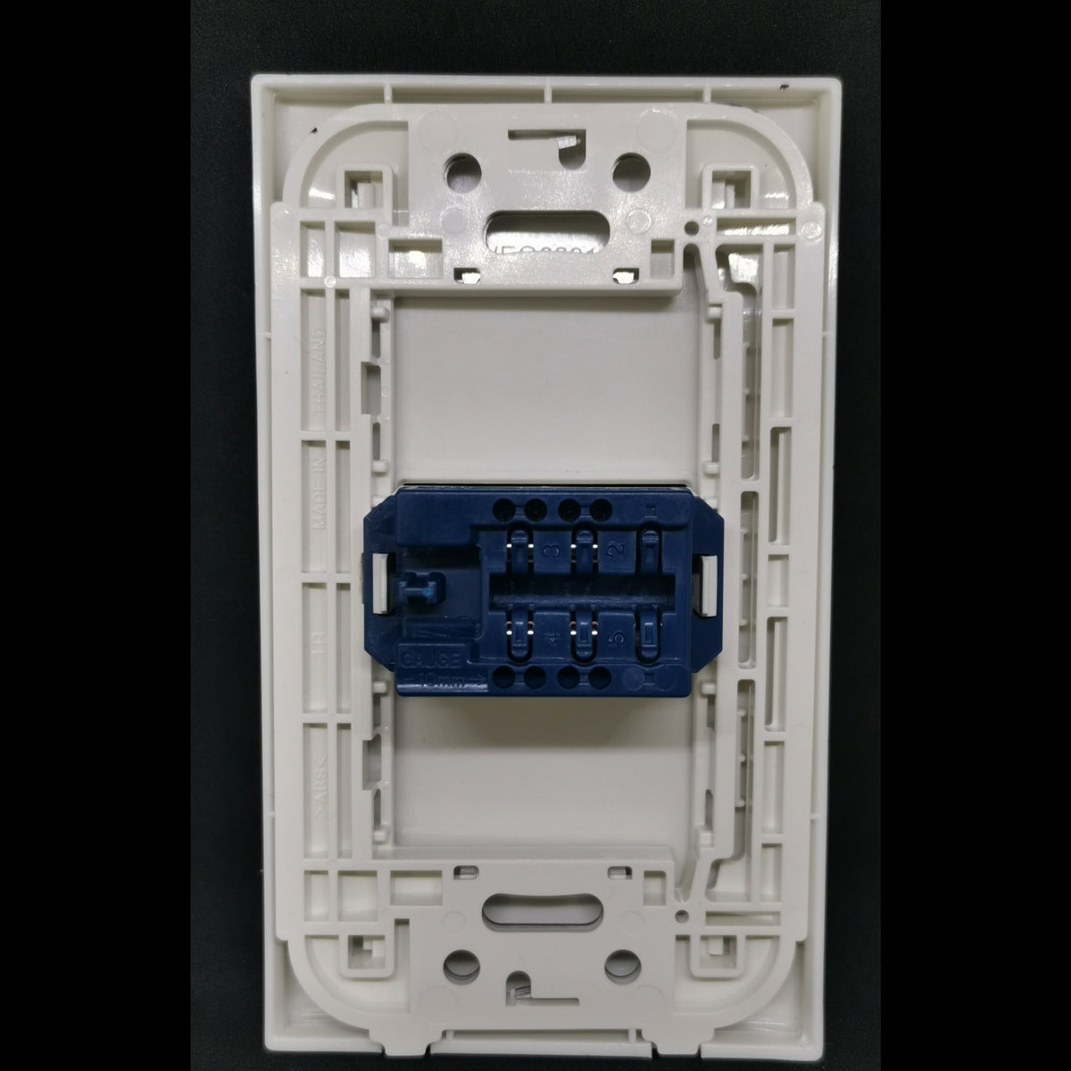 Panasonic Telephone Outlet Wide Series 1 Gang white wall plate back view with blue connector and mounting frame